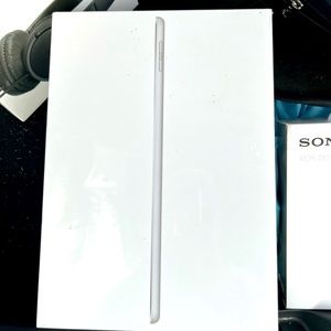 2 iPads and 5 sets of sony head phones all brand new never opened